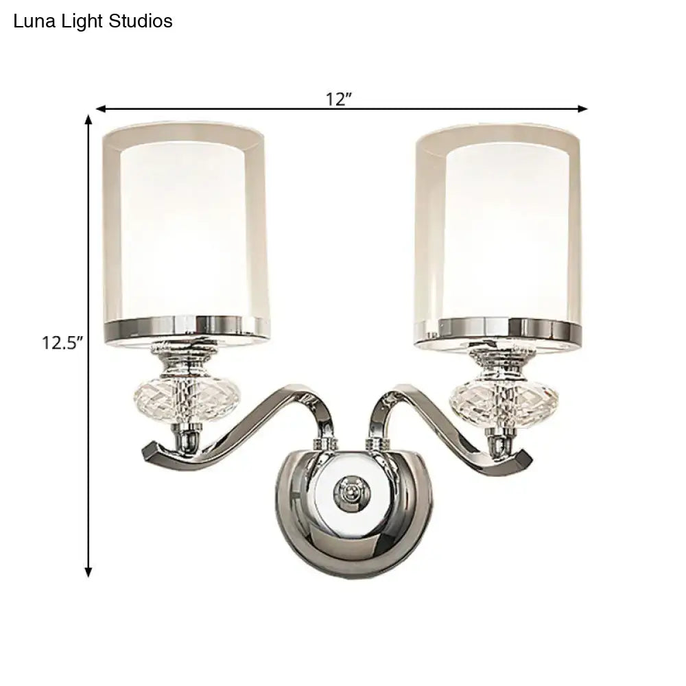 Modern chrome dual cylinder bathroom sconce with curvy arm