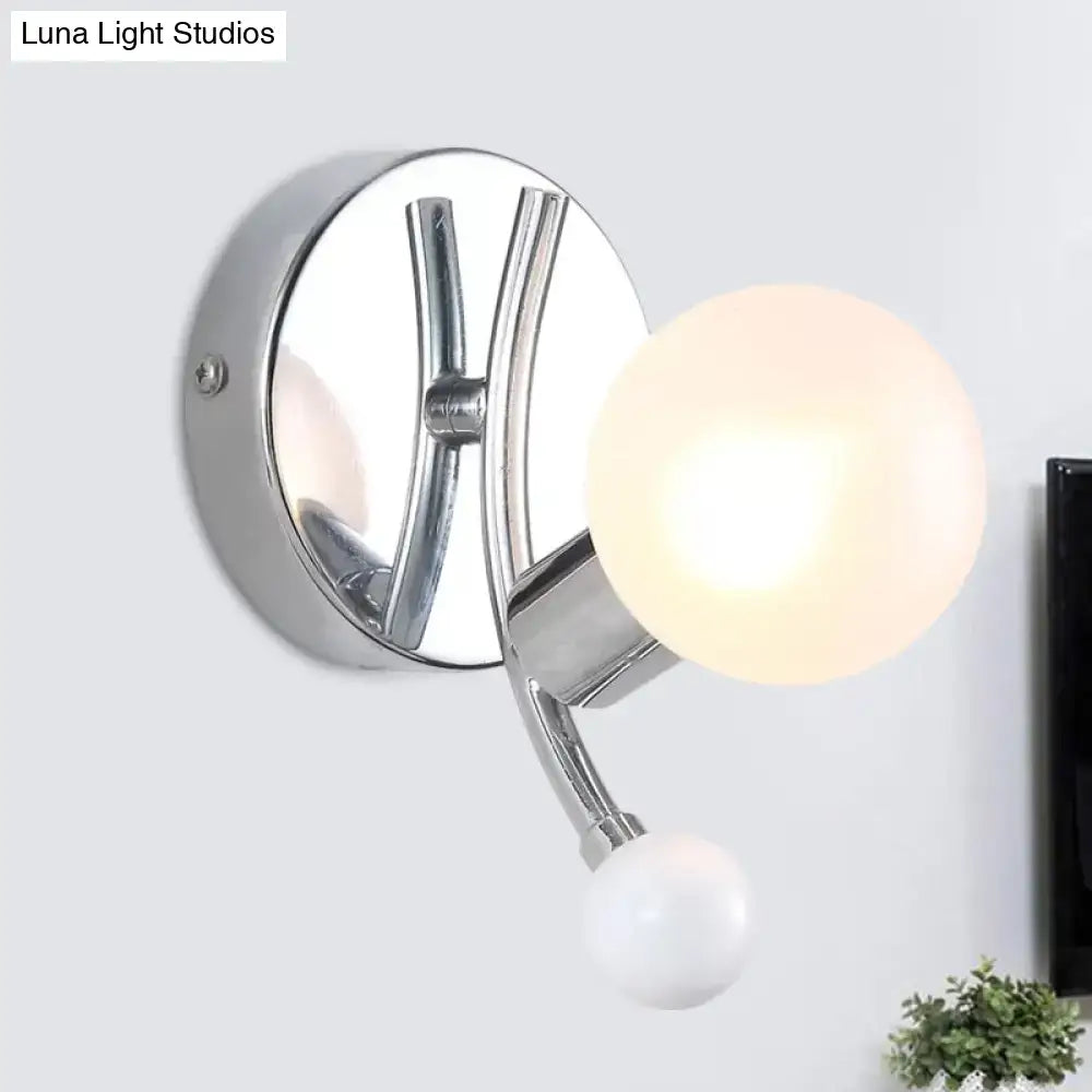 Modern chrome sconce with dual globe glass shades for living room