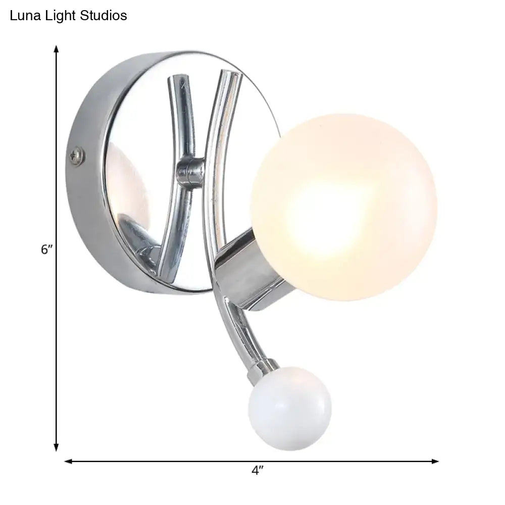 Modern chrome sconce with dual globe glass shades for living room
