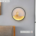 Modern circular black wall light with decorative deer living room