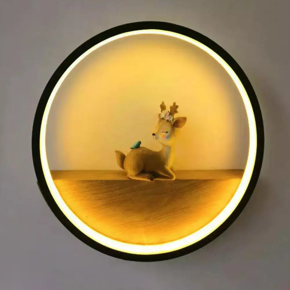 Modern circular black wall light with decorative deer living room
