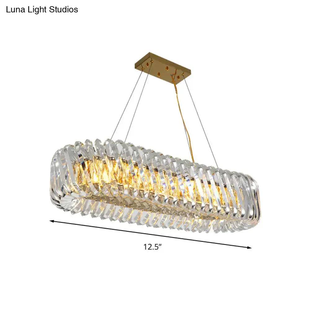 Modern gold and clear crystal oval pendant light for dining room