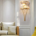 Modern gold curved wall light with clear crystal prism bedroom