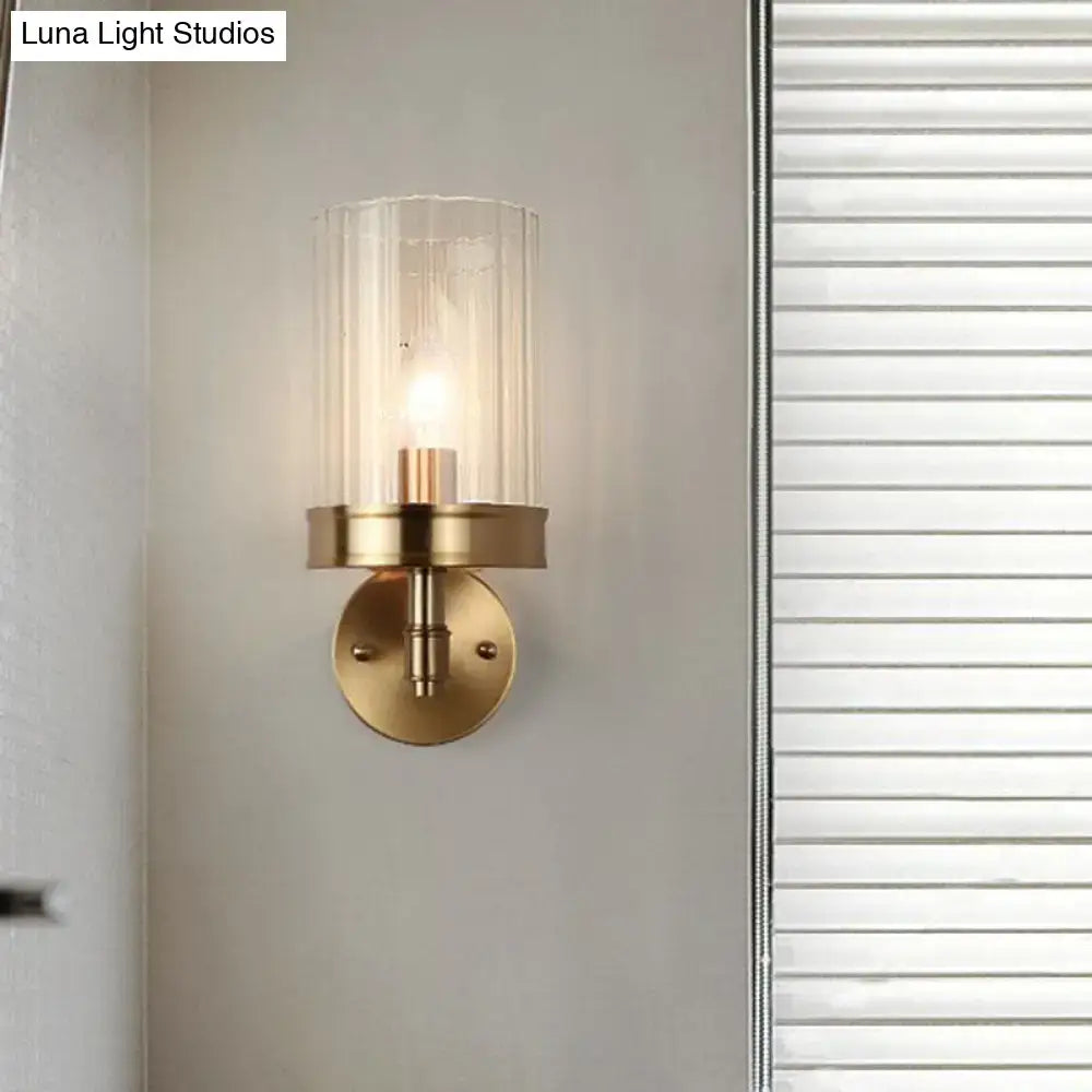 Modern gold finish wall light with glass shade – bedroom sconce
