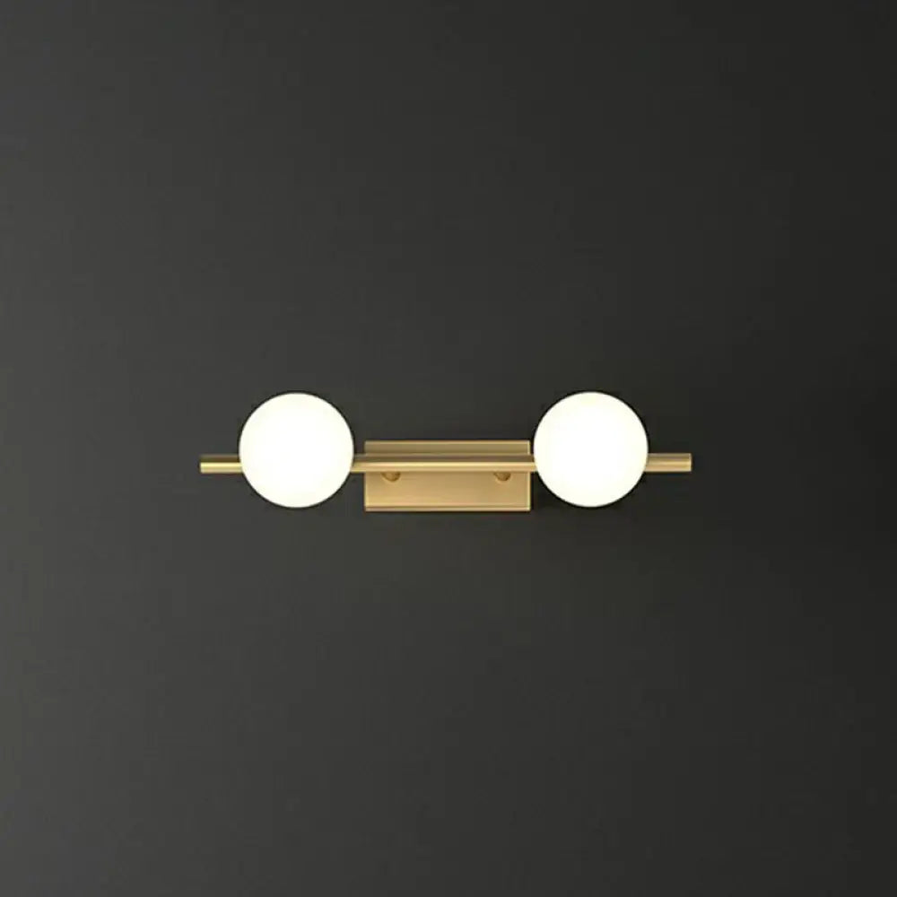 Modern gold linear wall sconce with milky ball glass for bathroom