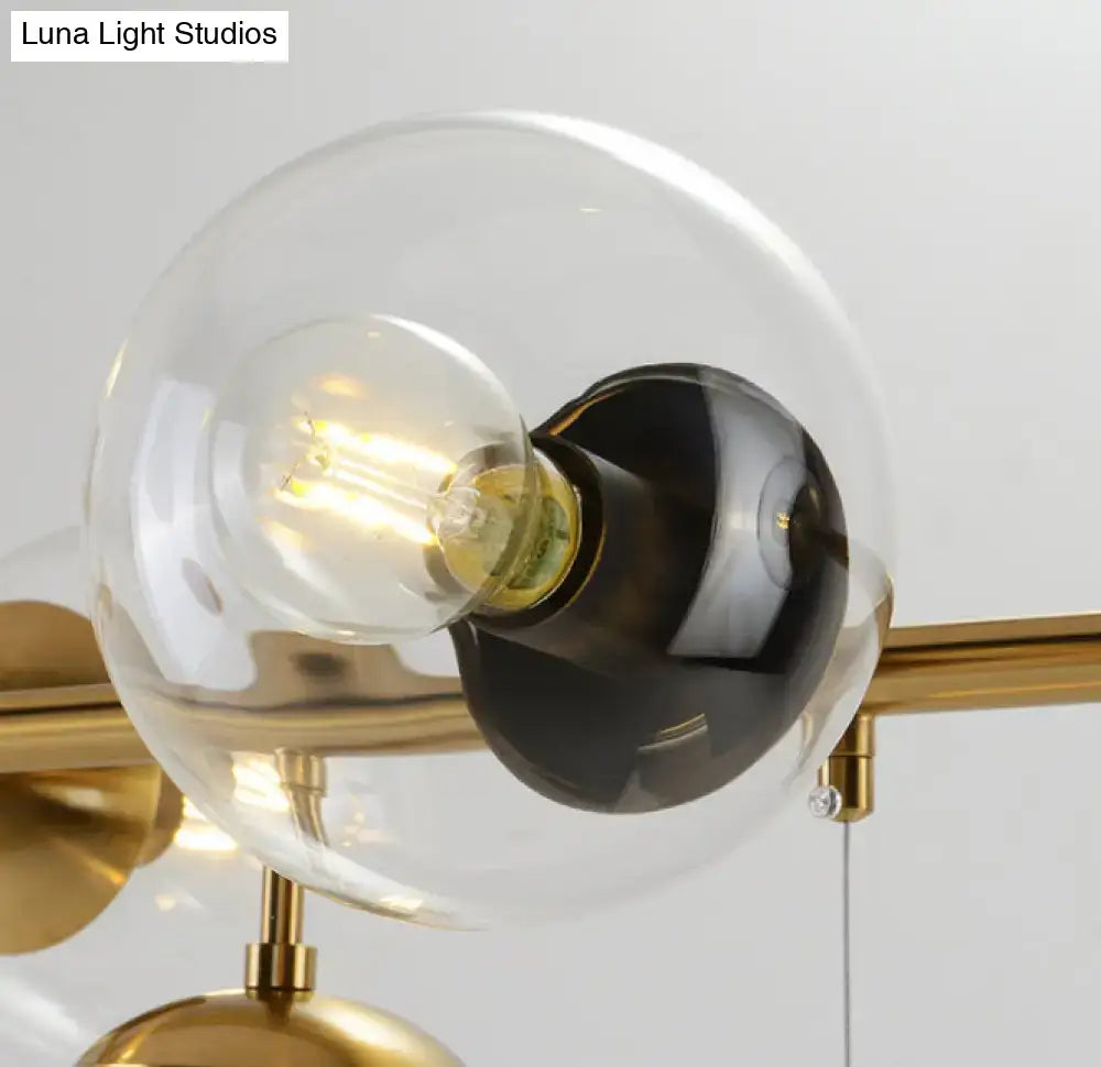 Modern gold metal island pendant with blue glass spheres dining room