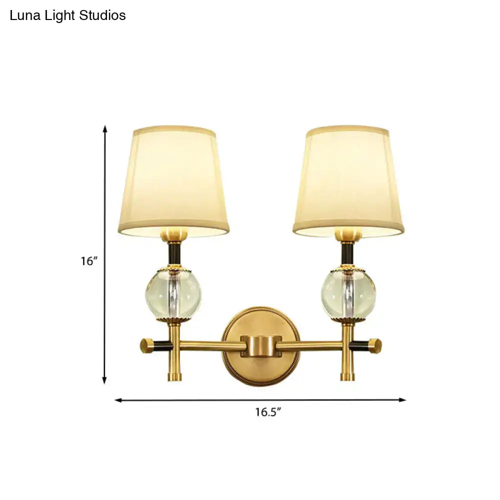 Modern gold wall light with crystal and fabric shade bedroom