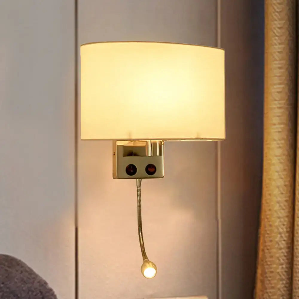 Modern gold wall sconce with fabric shade and bedroom reading light
