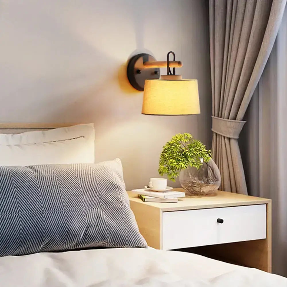 Modern grey drum shade wall lamp with wood arm for bedroom lighting