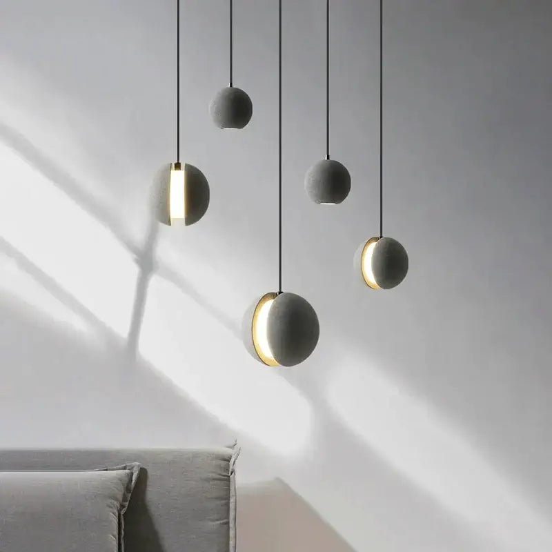 Modern minimalist gray and gold pendant light dining room