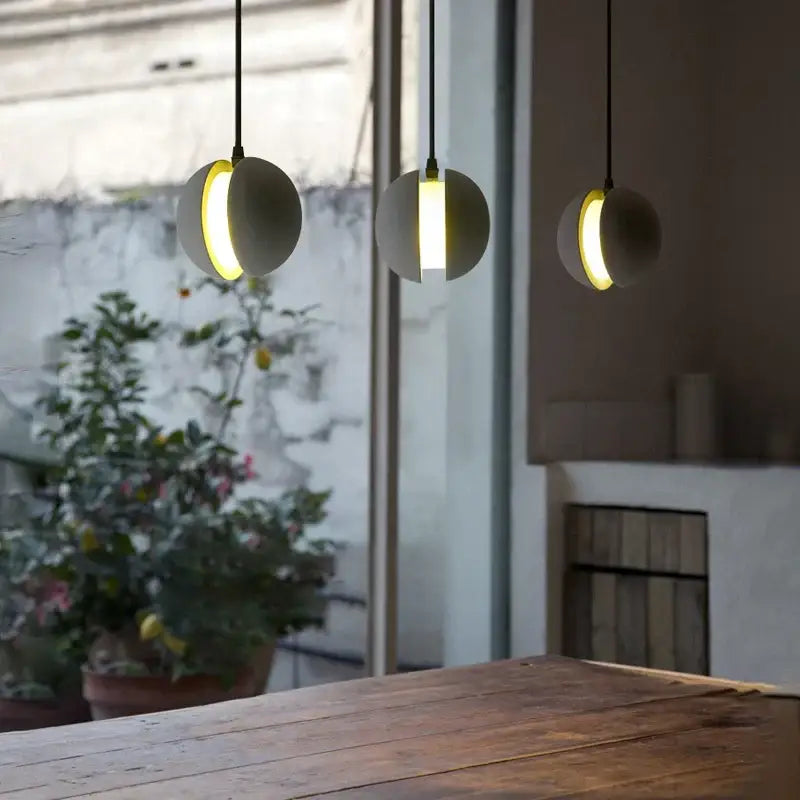 Modern minimalist gray and gold pendant light dining room