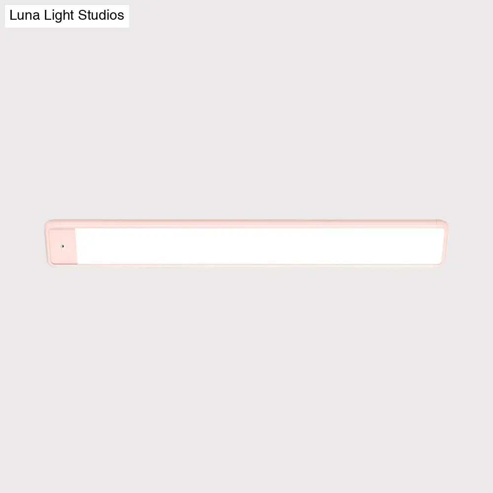 Modern pink elongated vanity lighting fixture for bedroom