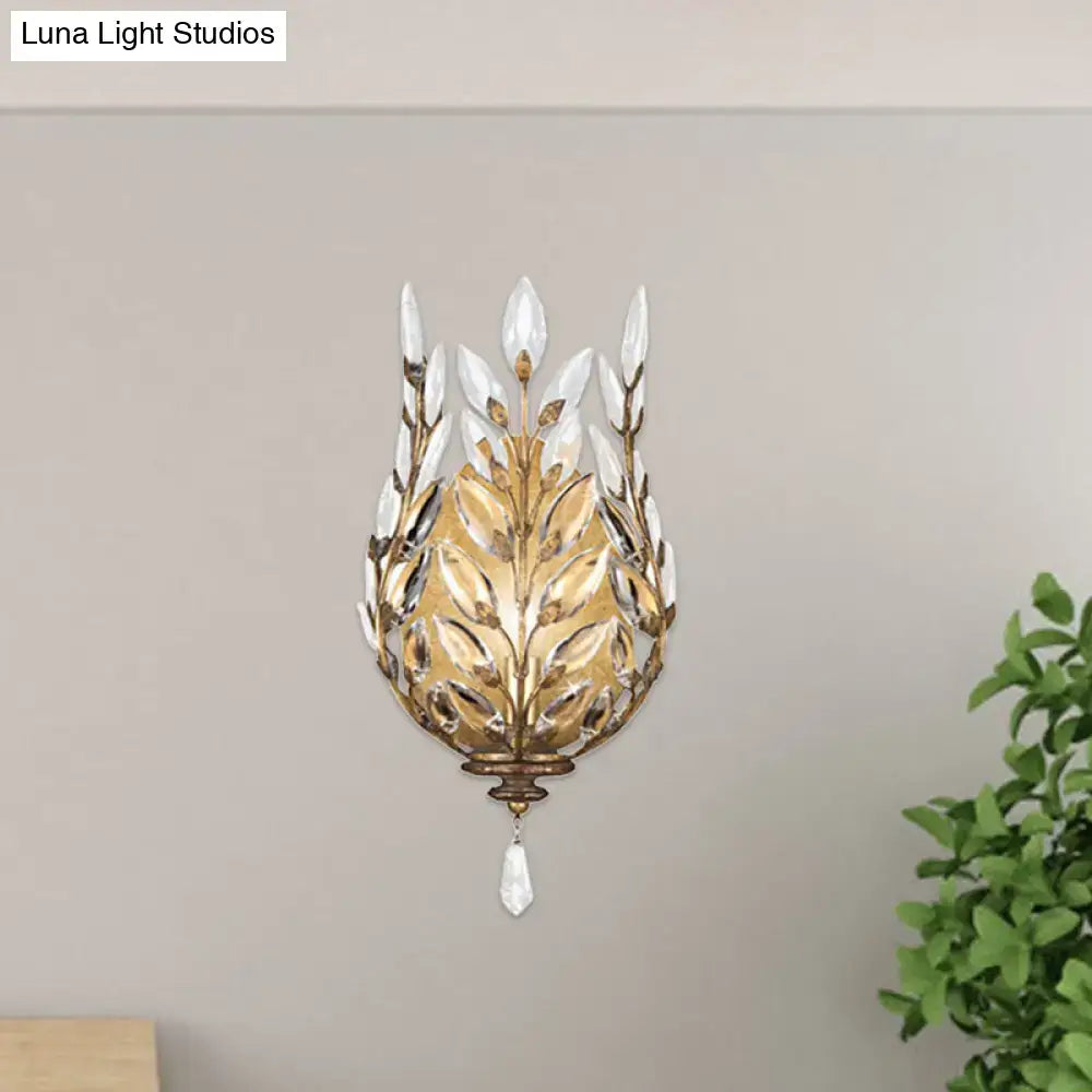 Modern silver & brass laurel wall light with crystal drop bedroom
