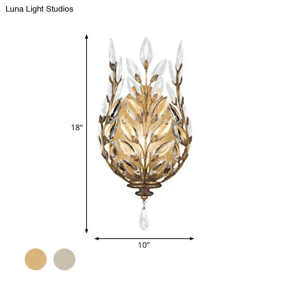 Modern silver & brass laurel wall light with crystal drop bedroom