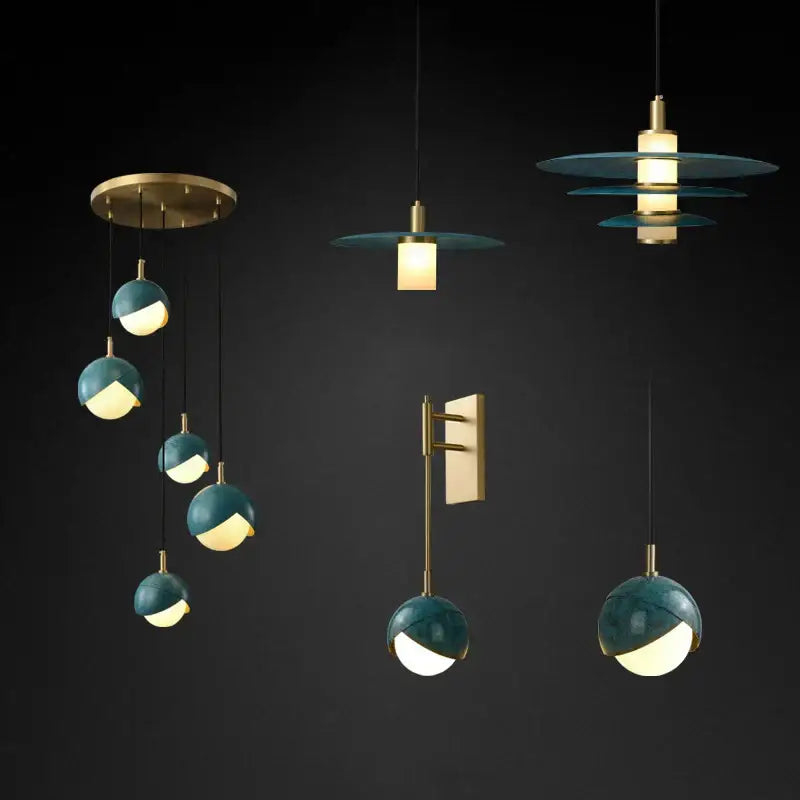 Modern teal glass and brass pendant light for kitchen island