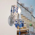 Modern white wall light with blue crystal draping bedroom sconce