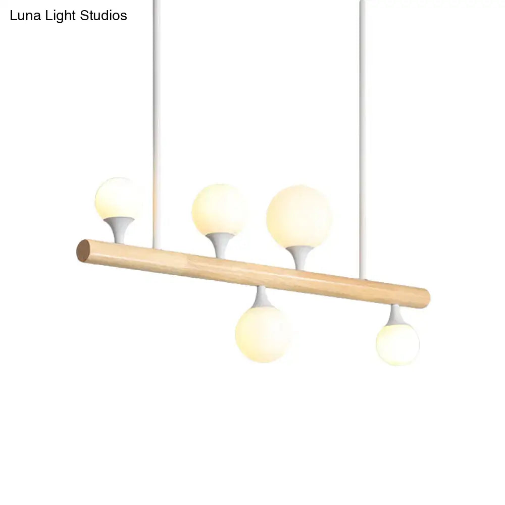 Modern wood island lamp with five globe lights dining room