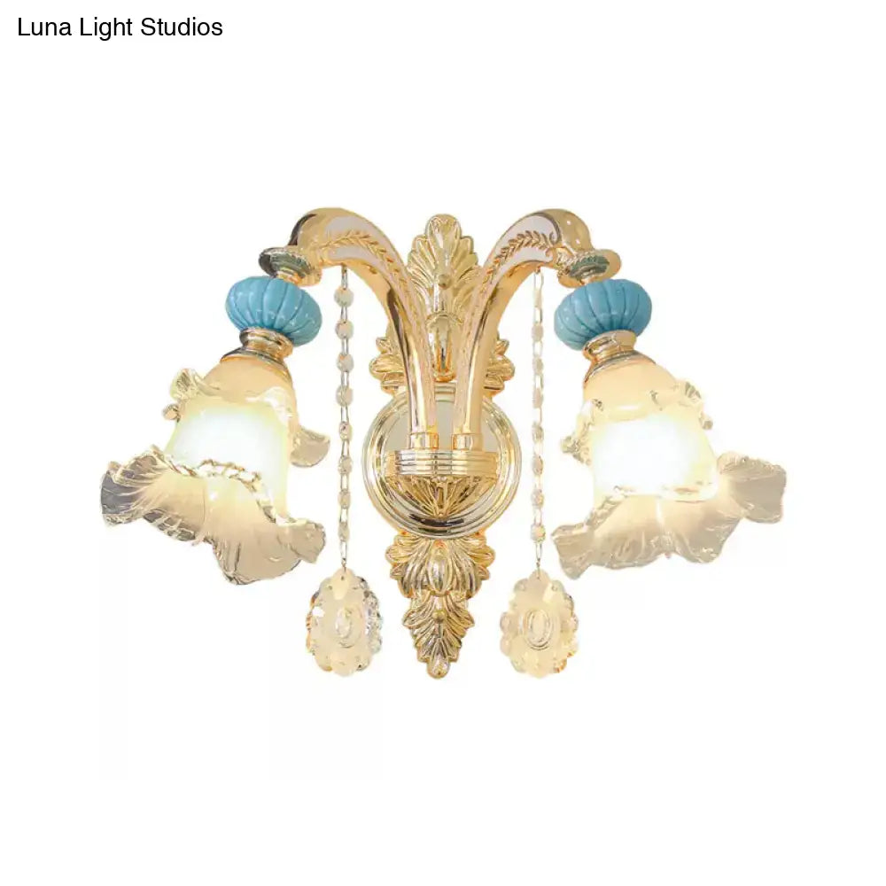 Ornate gold and blue glass wall mount light bedroom sconce