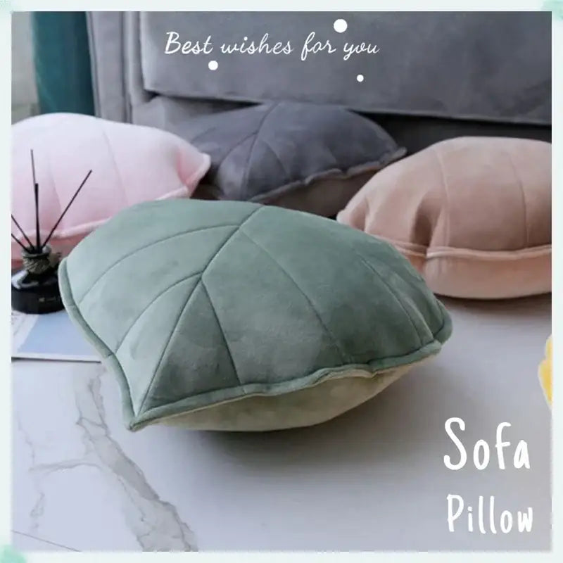 Plush leaf shaped throw pillows in sage and mustard for living room