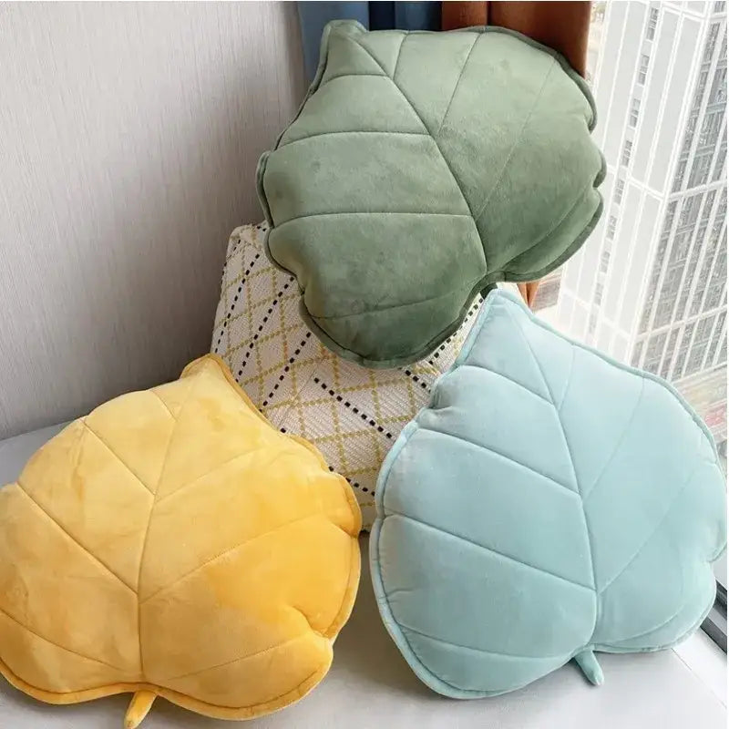 Plush leaf shaped throw pillows in sage and mustard for living room