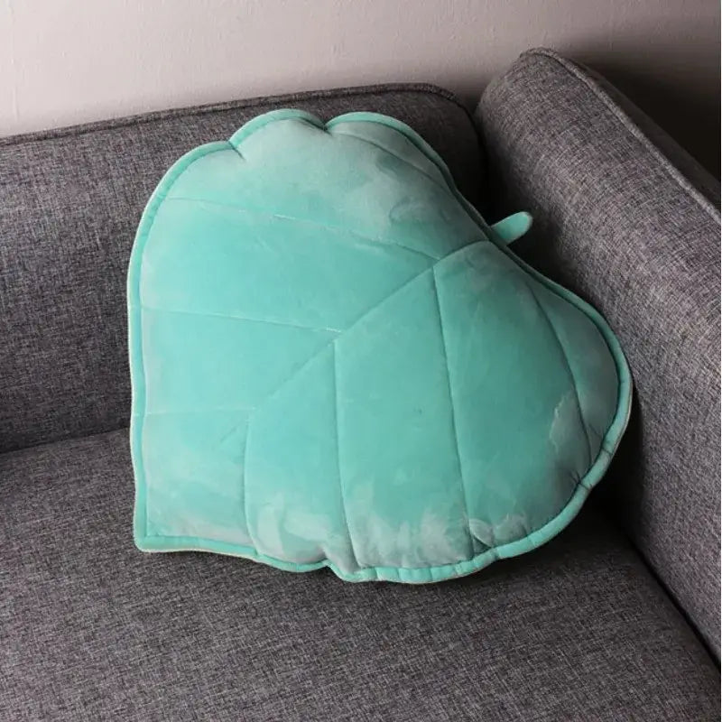 Plush leaf shaped throw pillows in sage and mustard for living room