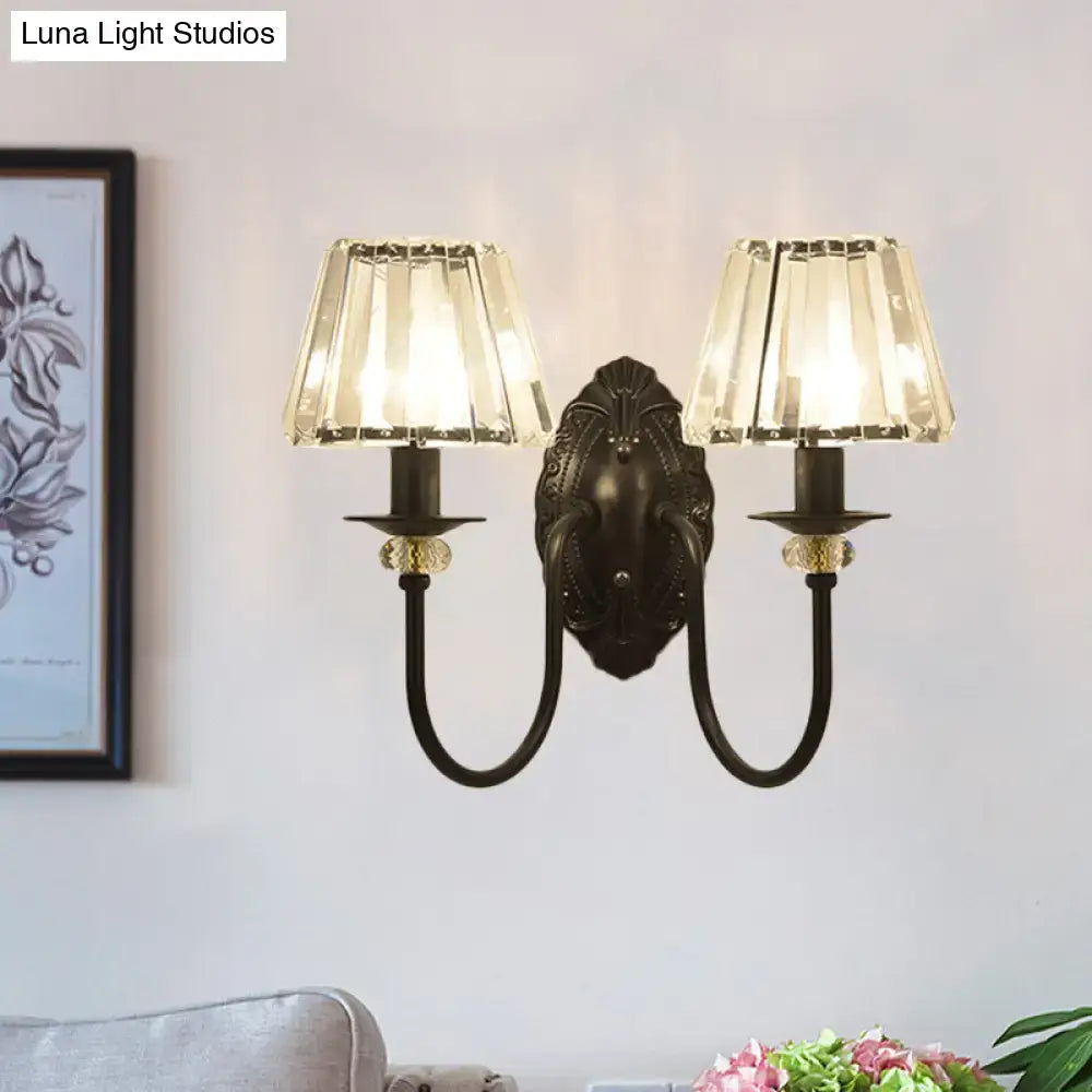 Post-modern black metal wall sconce with clear crystal shade bedroom