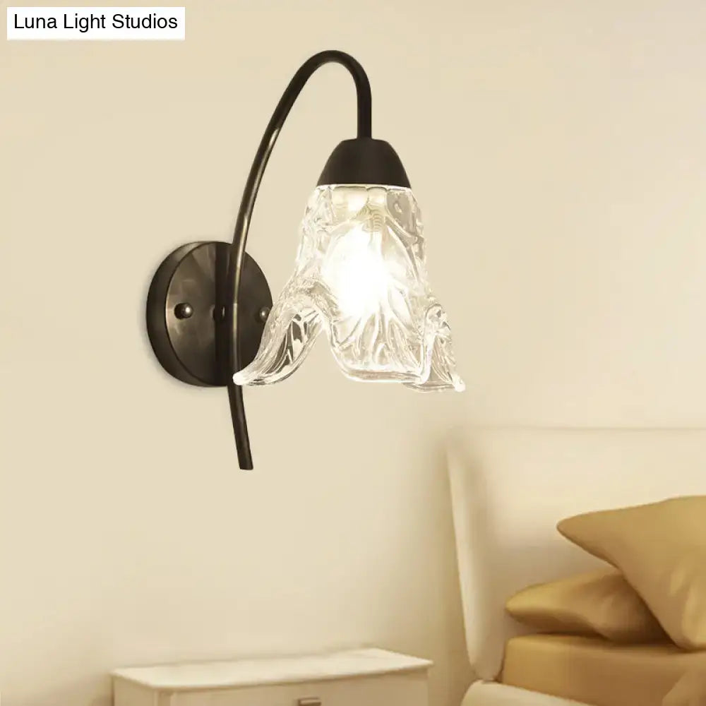 Post-modern black metal wall sconce with clear crystal shade bedroom