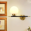 Post-modern white and brass sphere wall sconce bedroom light