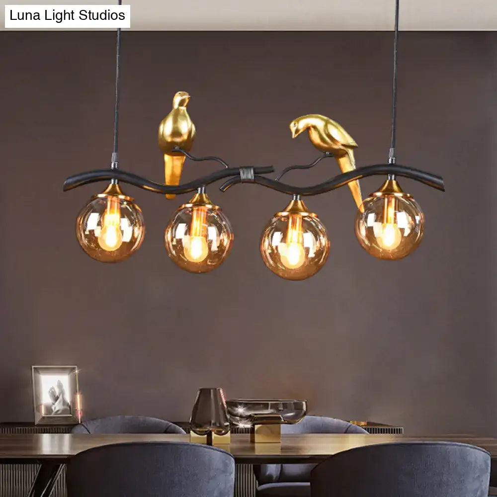 DecorBites™ Postmodern Iron Pendant Light with 4-Lights, Black/Gold Finish, Amber Ball Glass Shade, Bird Deco - Sprig Island