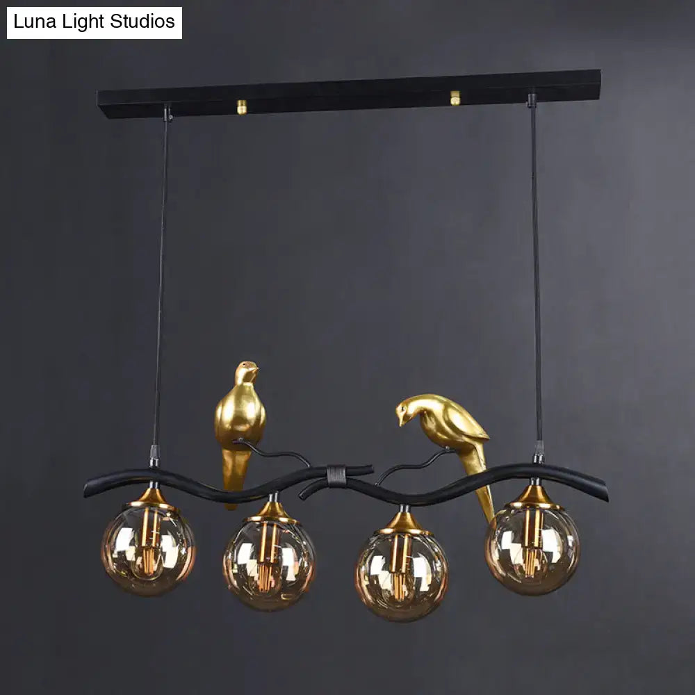DecorBites™ Postmodern Iron Pendant Light with 4-Lights, Black/Gold Finish, Amber Ball Glass Shade, Bird Deco - Sprig Island