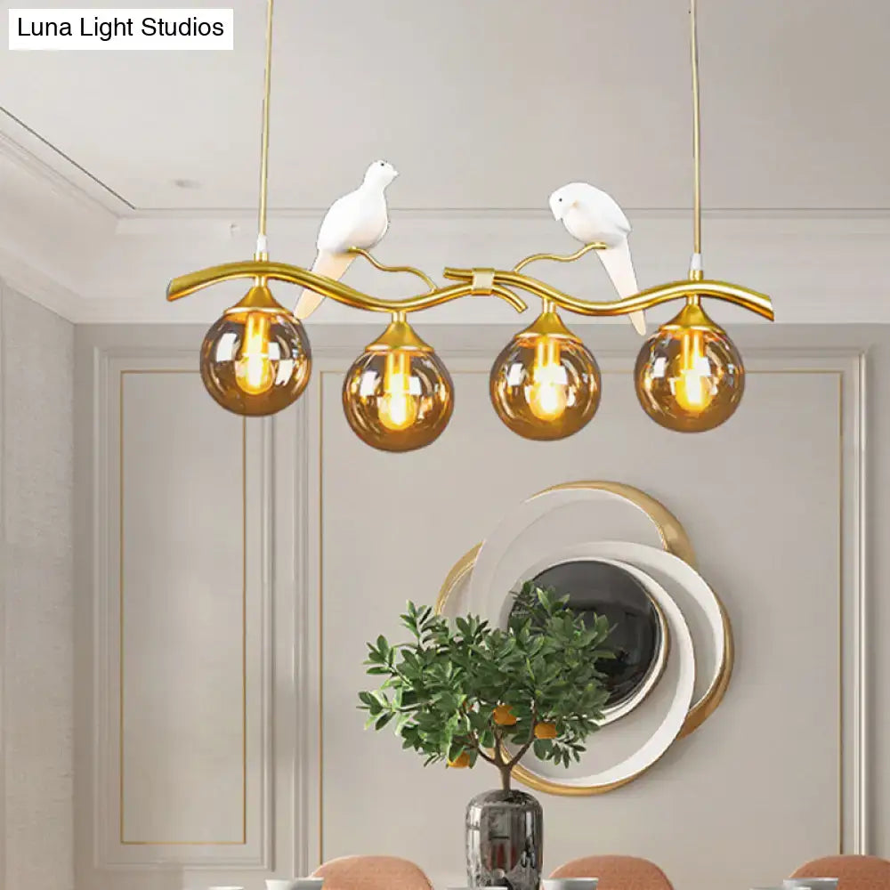 DecorBites™ Postmodern Iron Pendant Light with 4-Lights, Black/Gold Finish, Amber Ball Glass Shade, Bird Deco - Sprig Island