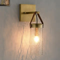 Postmodern brass wall sconce with clear crack glass and leather strap dining room light
