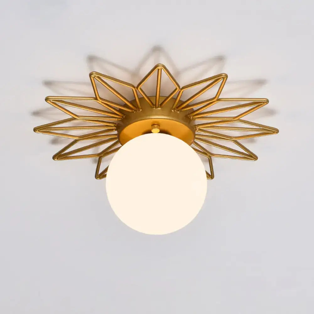 Postmodern gold sunburst ceiling light with cream glass shade bedroom