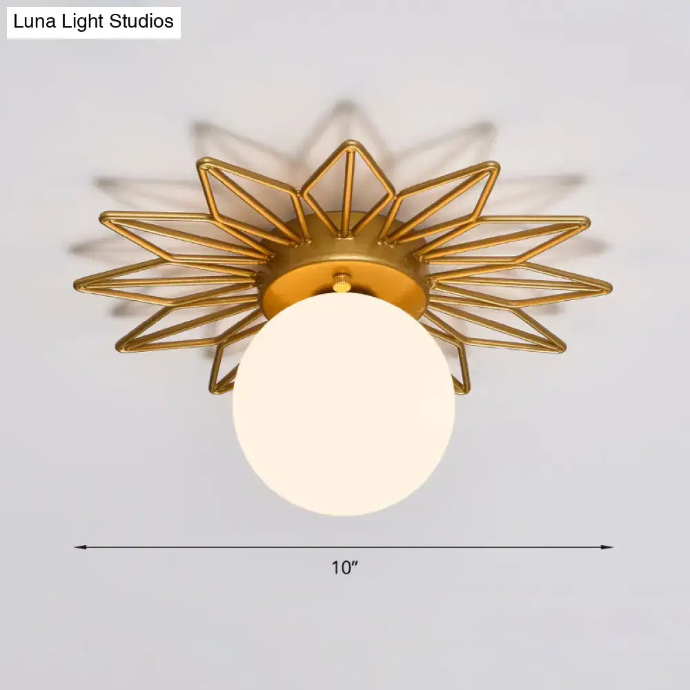 Postmodern gold sunburst ceiling light with cream glass shade bedroom