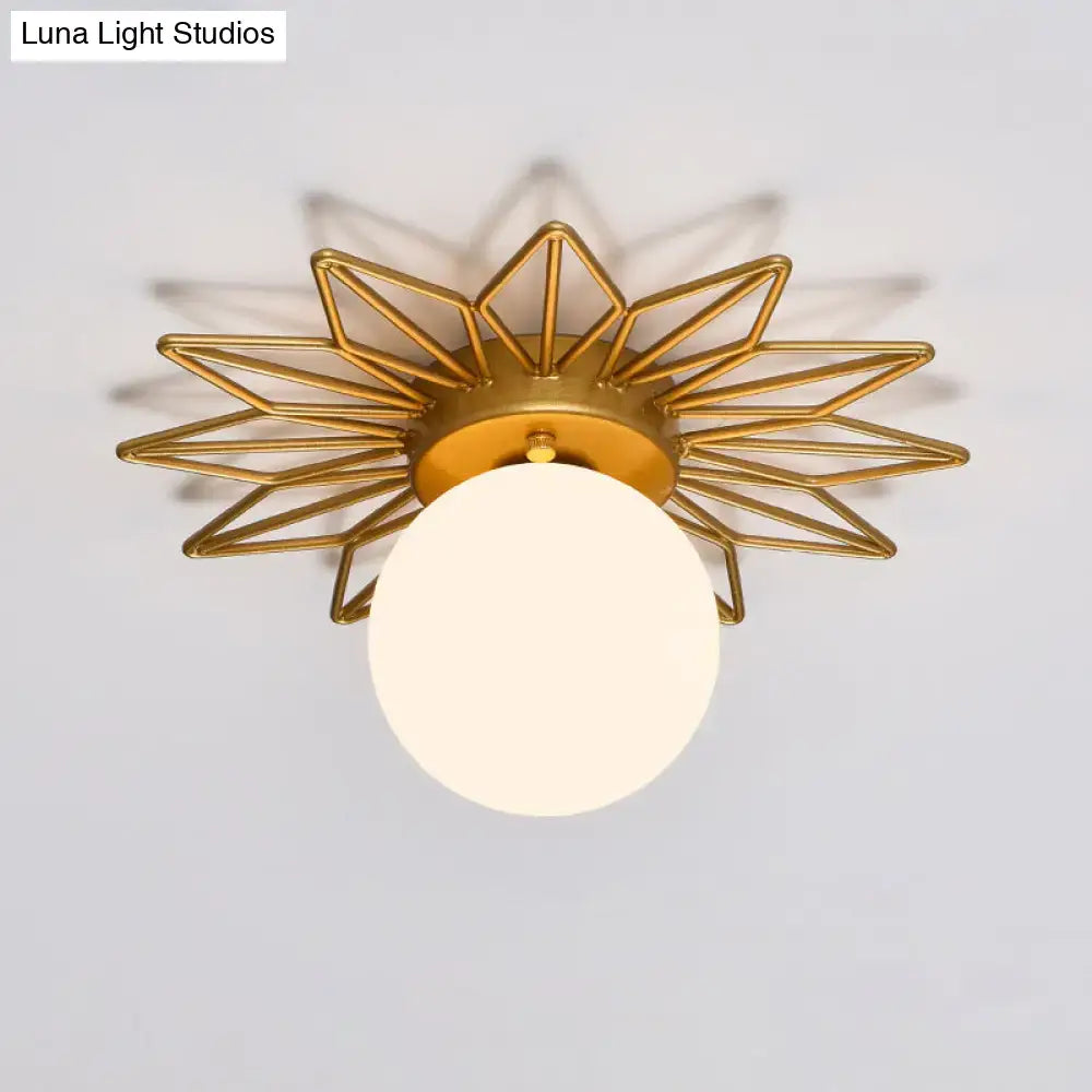 Postmodern gold sunburst ceiling light with cream glass shade bedroom