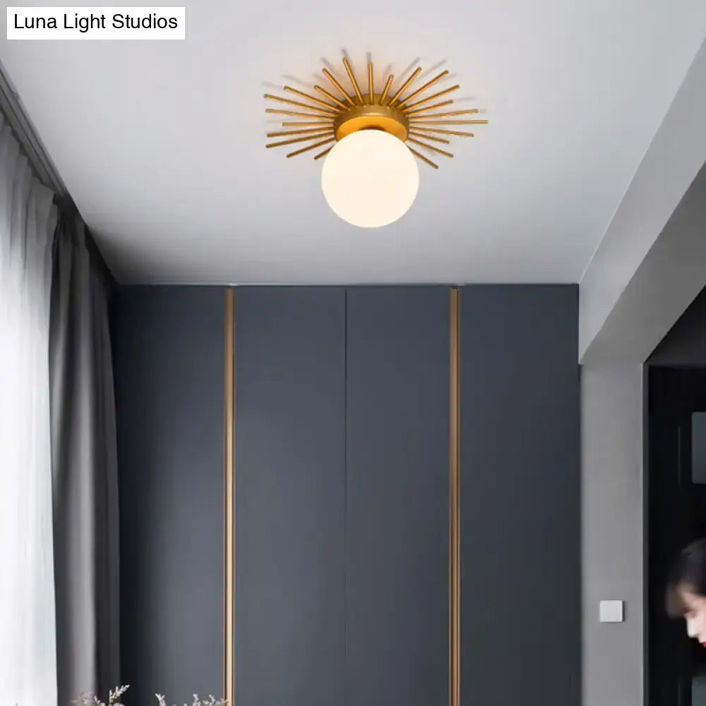 Postmodern gold sunburst ceiling light with cream glass shade bedroom