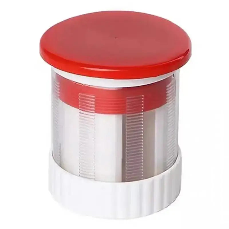 Red and white manual citrus juicer kitchen tool with measuring cup