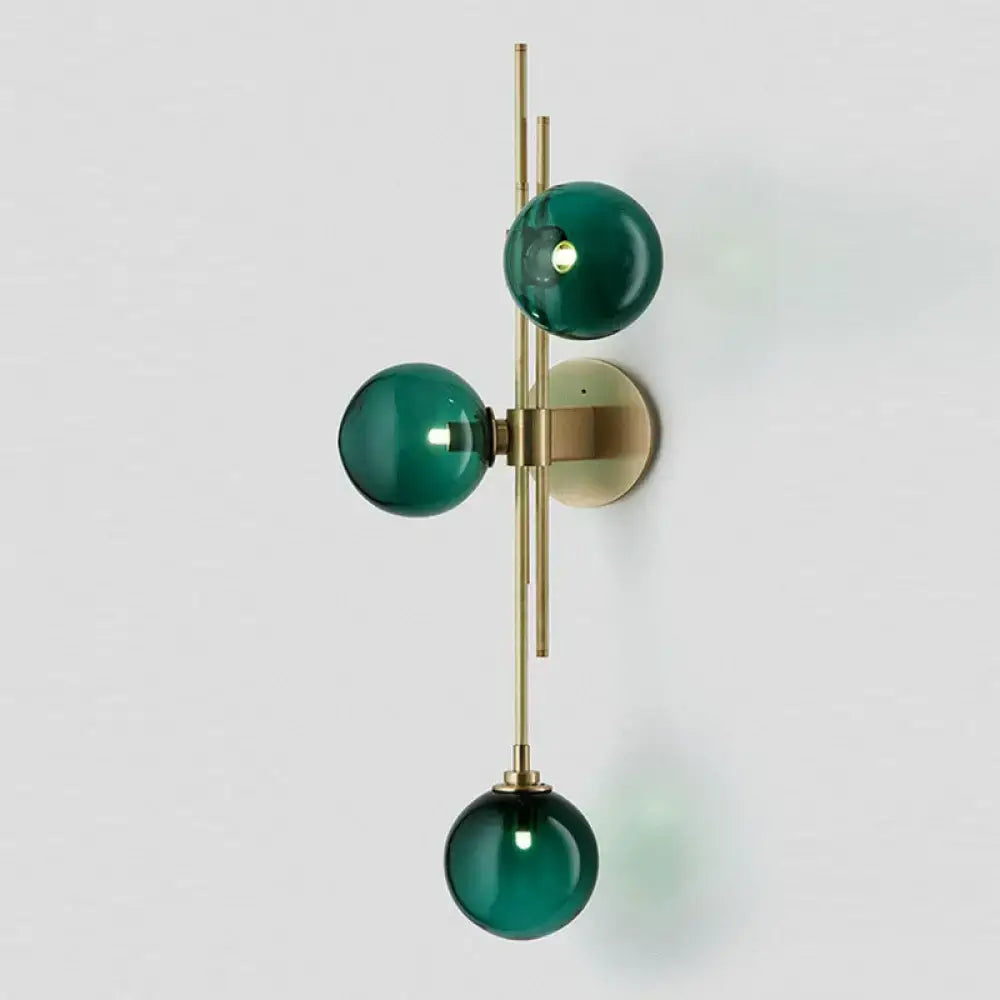 Retro brass wall sconce with 3 glass globes for dining room