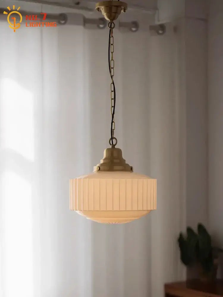 Ribbed cream glass and brass pendant light for dining room