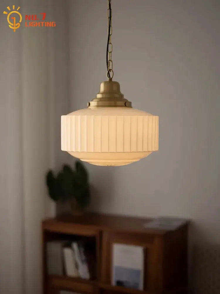 Ribbed cream glass and brass pendant light for dining room