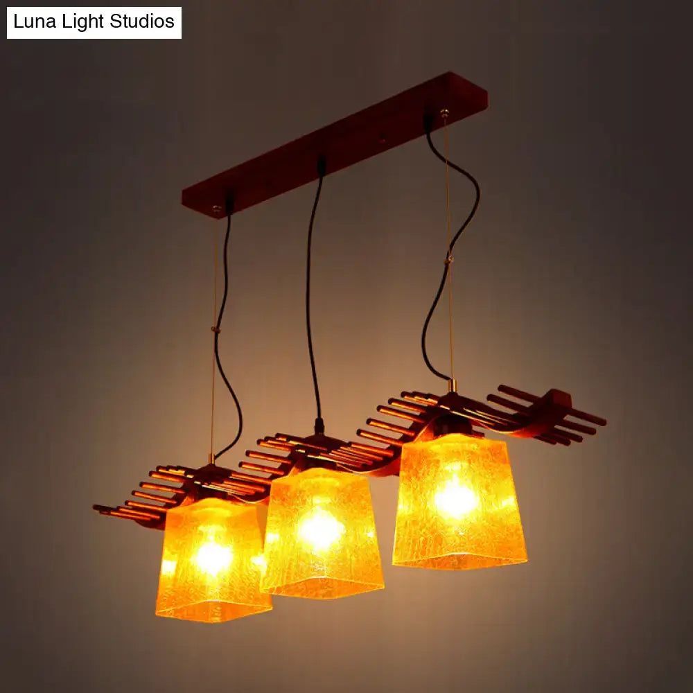 Rustic wood dining room pendant with yellow crackle glass shades