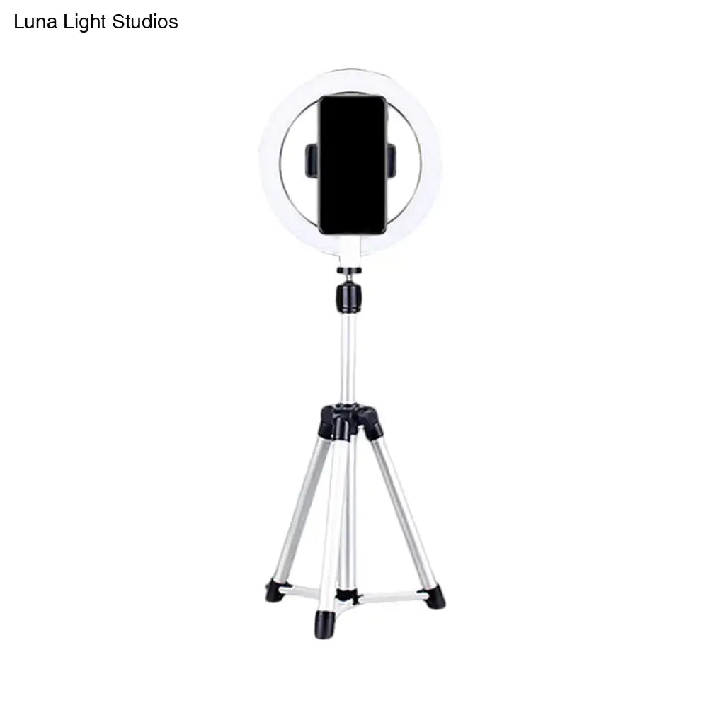 Sleek silver and white circular fill-in lamp bedroom phone holder