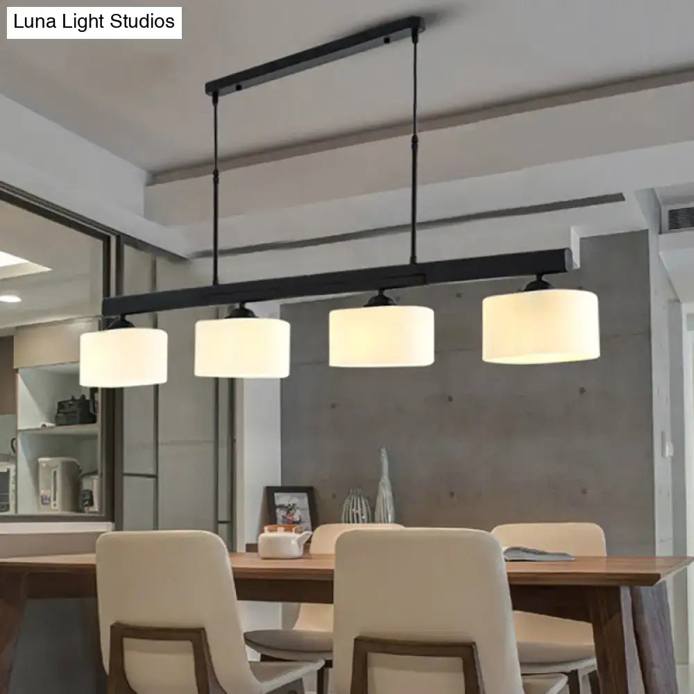 Traditional black drum island pendant with white shades dining room