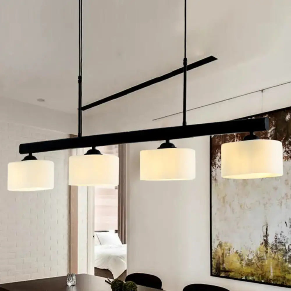 Traditional black drum island pendant with white shades dining room