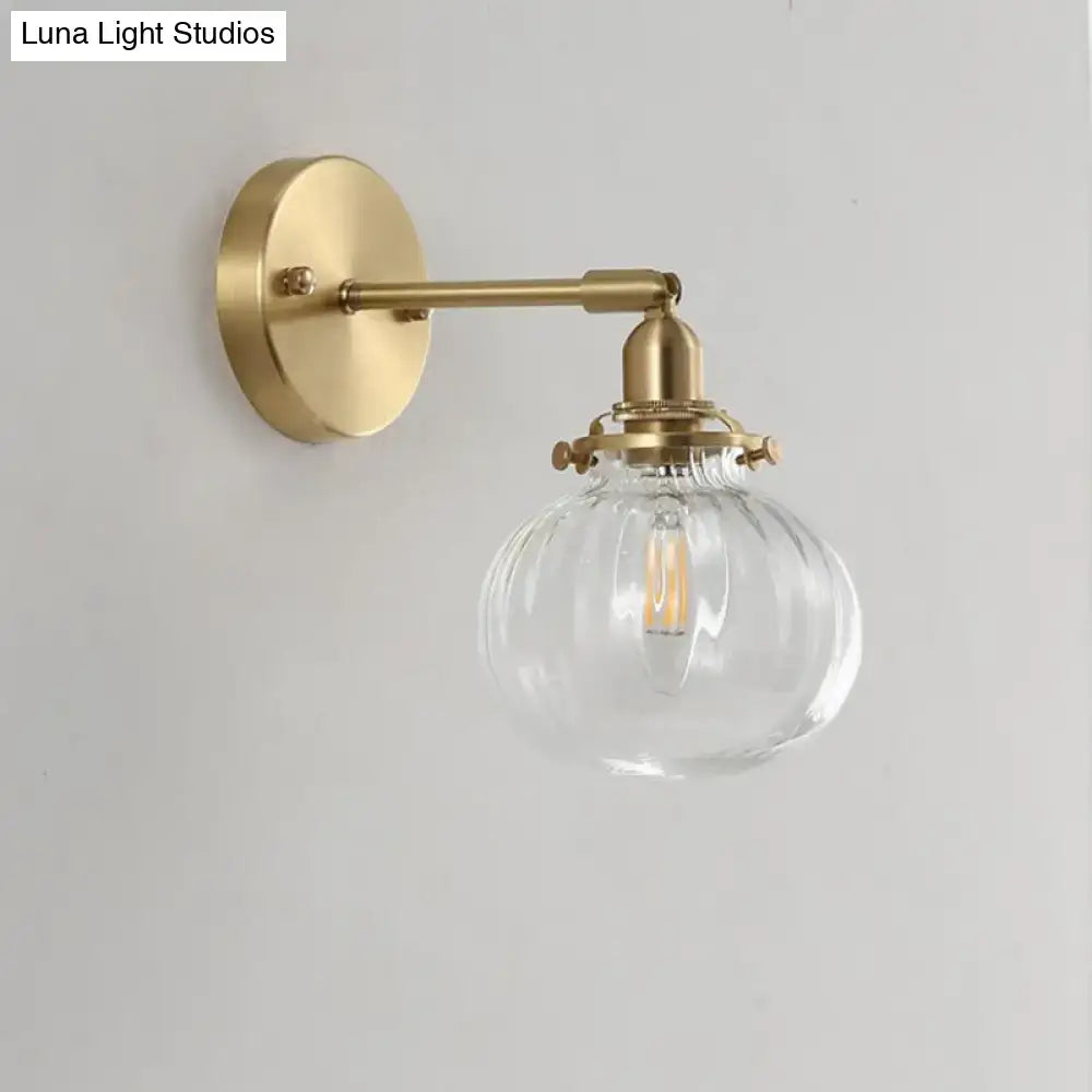 Vintage brass wall light with champagne & clear glass shade bedroom