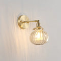 Vintage brass wall light with champagne & clear glass shade bedroom