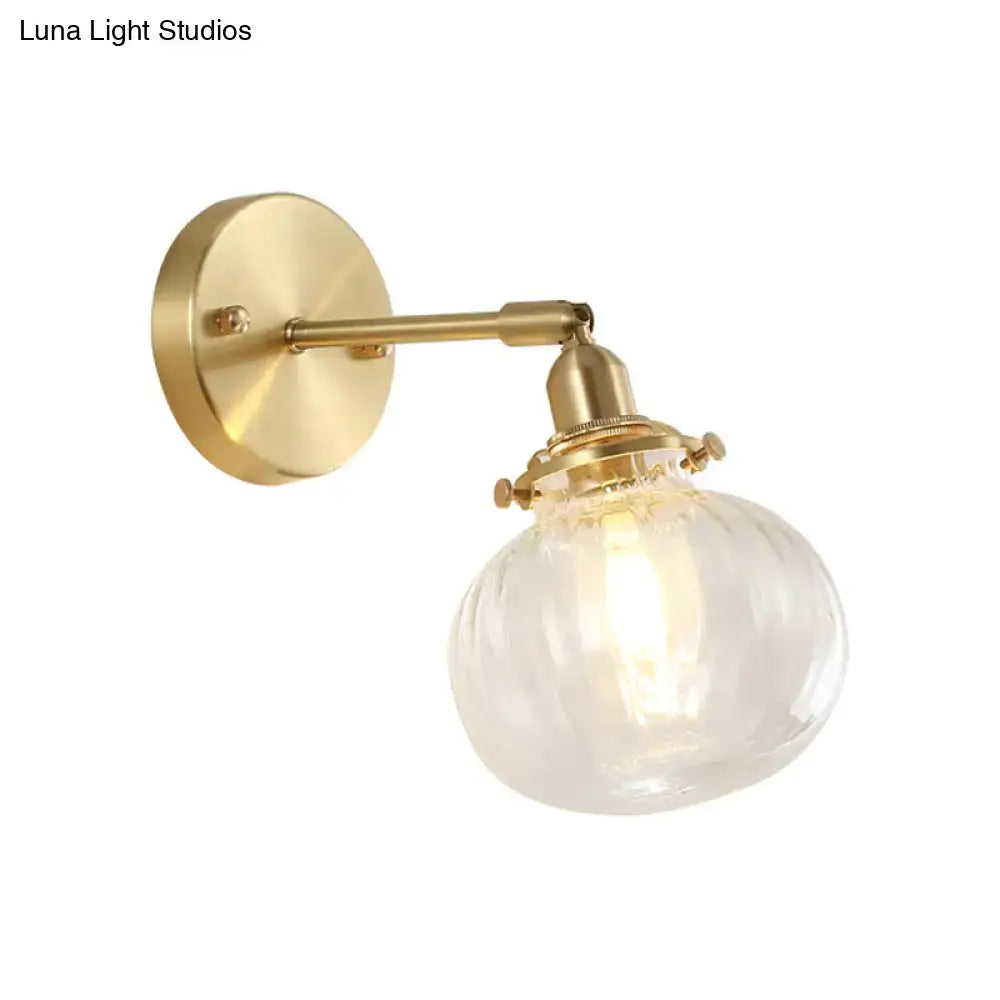 Vintage brass wall light with champagne & clear glass shade bedroom