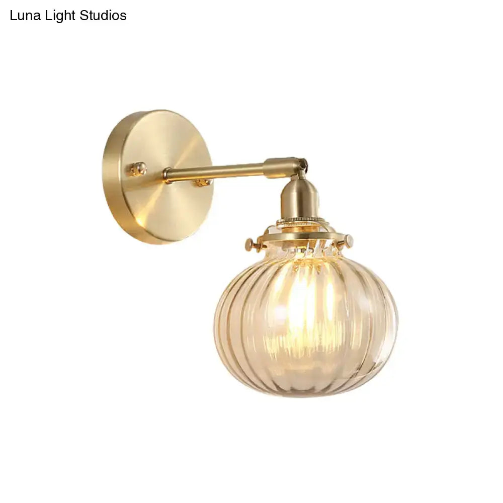 Vintage brass wall light with champagne & clear glass shade bedroom