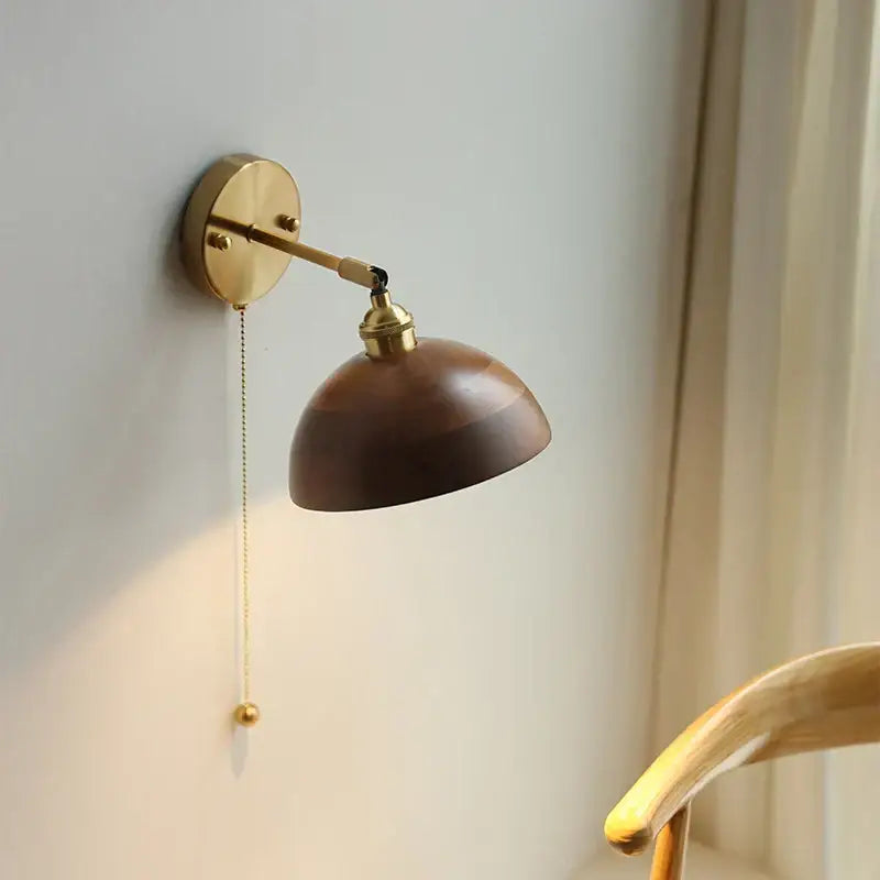 Walnut and brass wall sconce with pull chain switch bedroom light