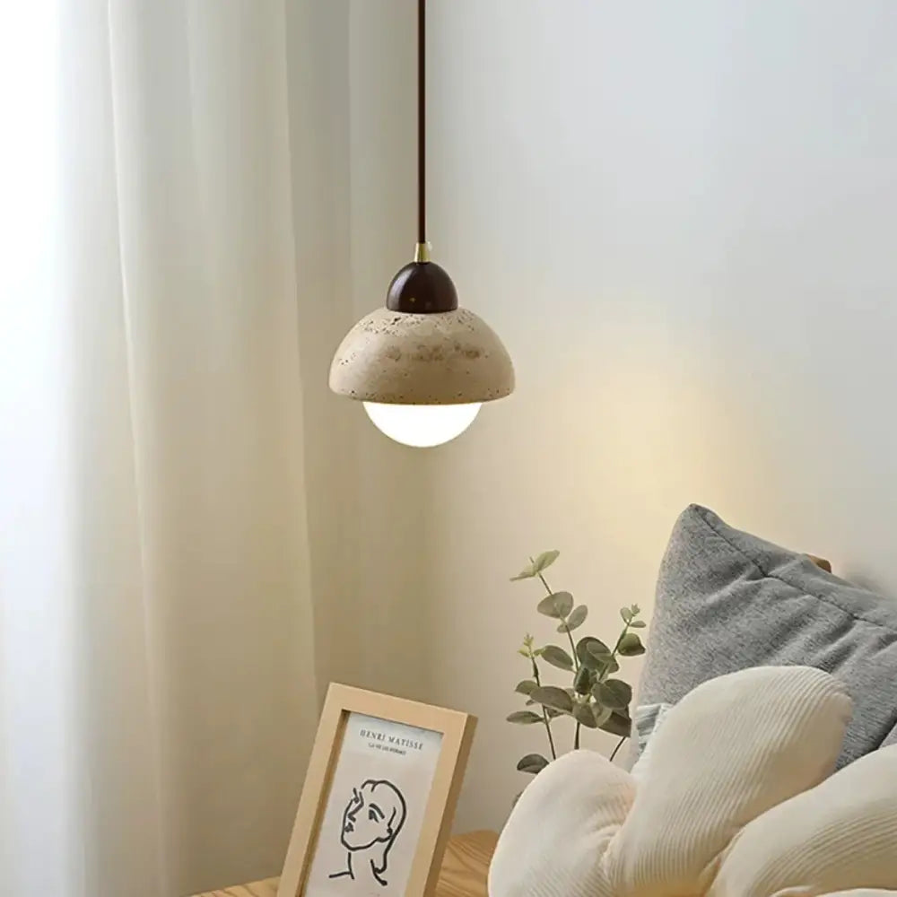 Warm textured concrete cave stone pendant light dining room
